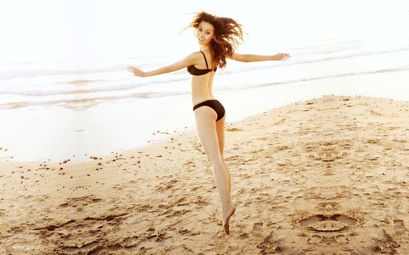 woman jumping on beach