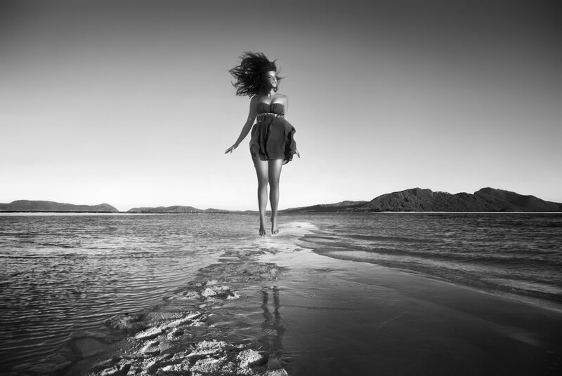Woman Jumping on Beach — Black, Dramatic