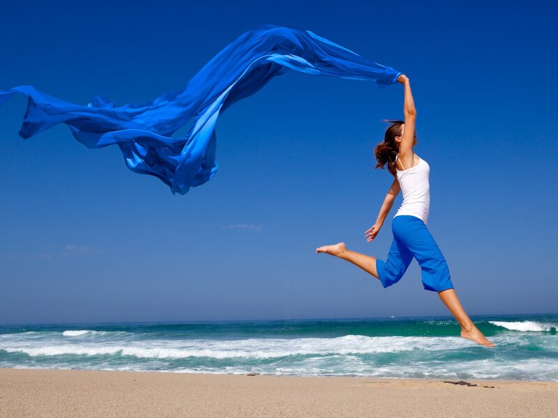 Woman Jumping on Beach — Blue, Energetic