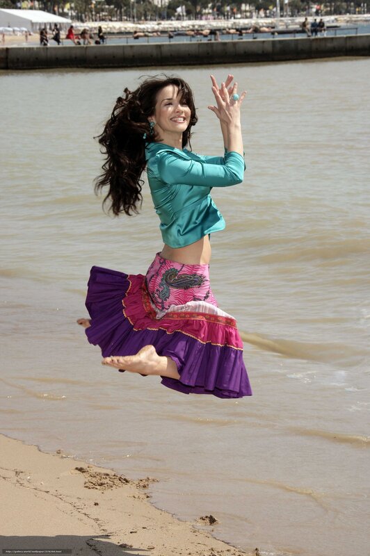 woman jumping on beach