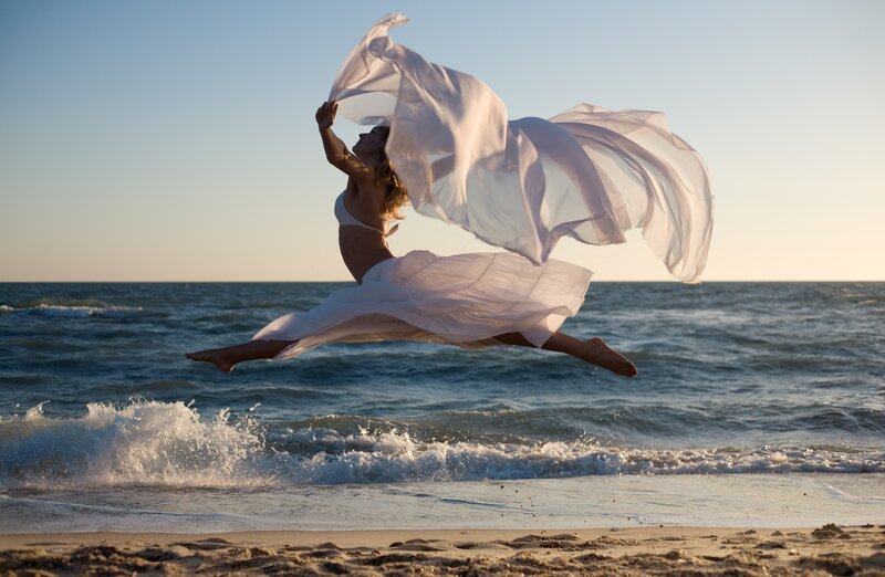 Woman Jumping on Beach — White