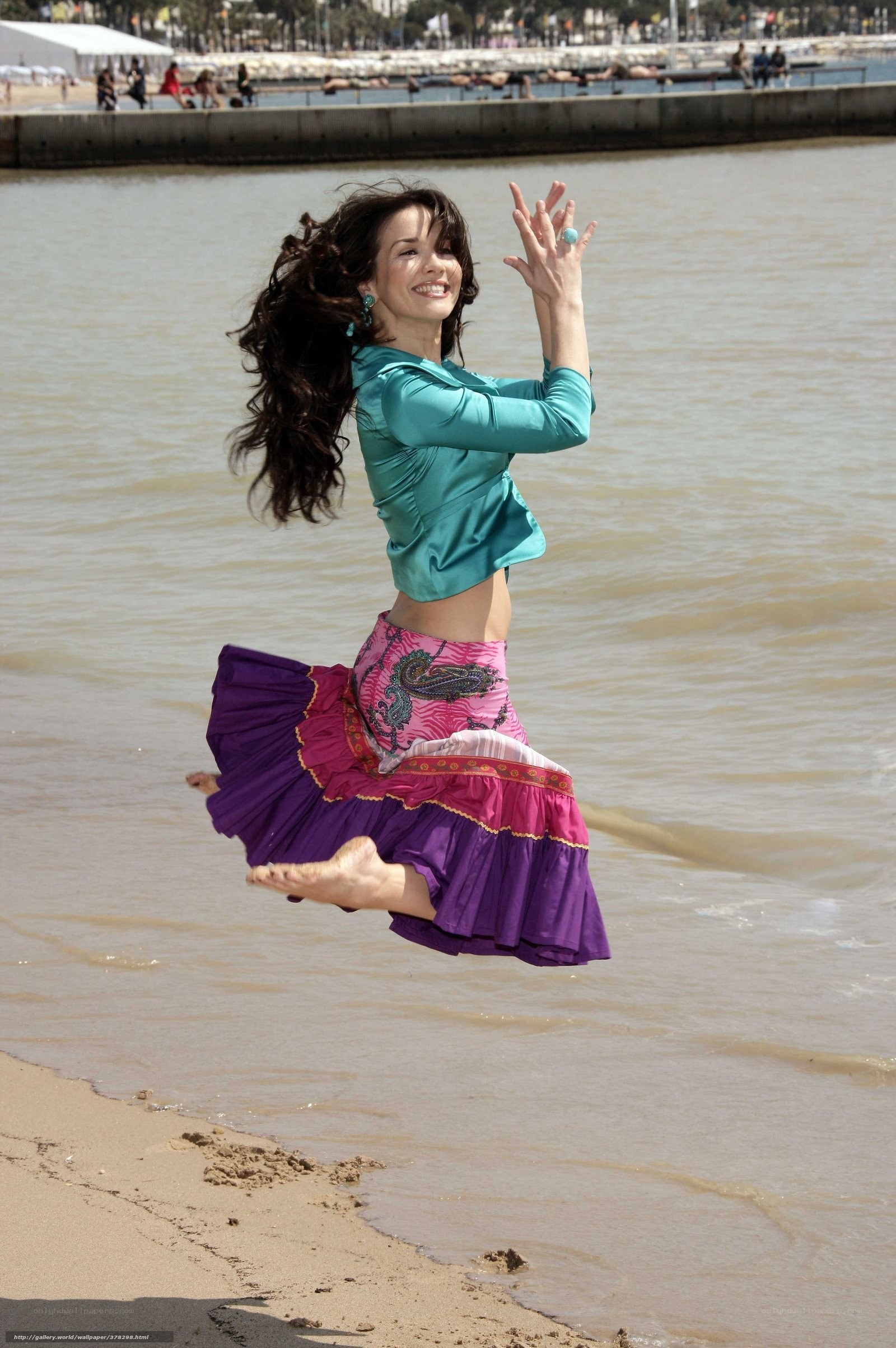 woman jumping on beach