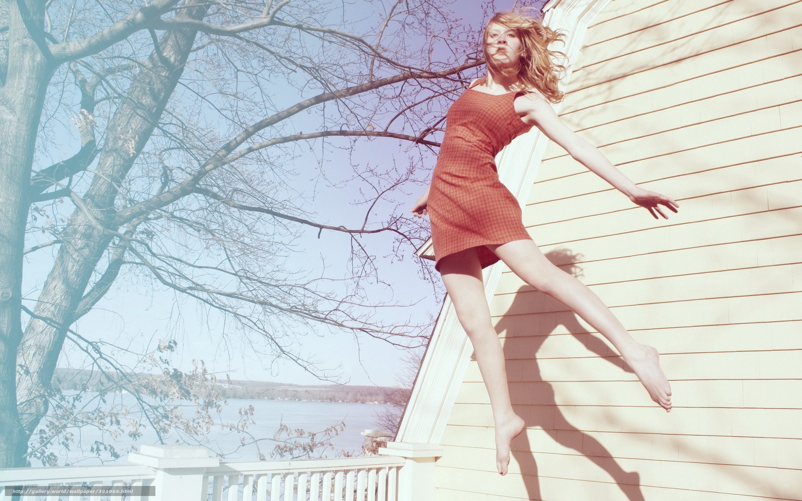 Woman jumping on porch
