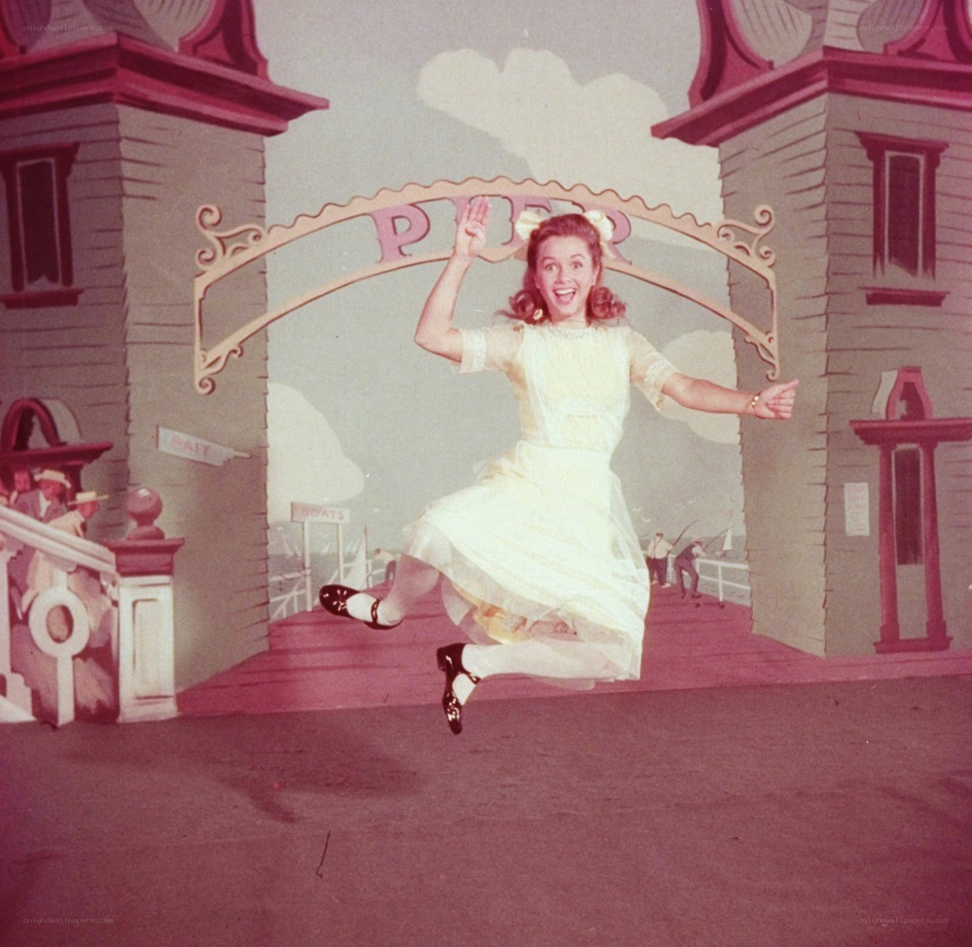 woman jumping on stage