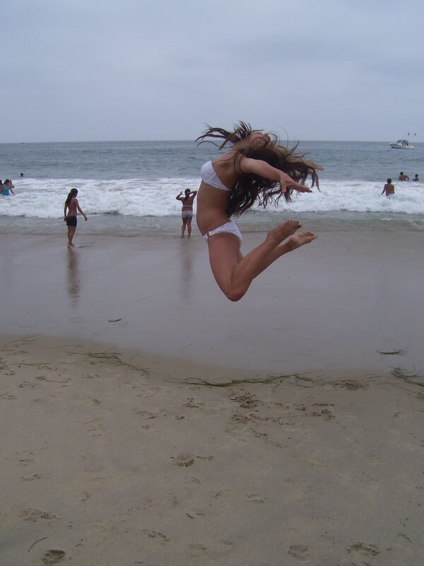 Woman jumping on the beach