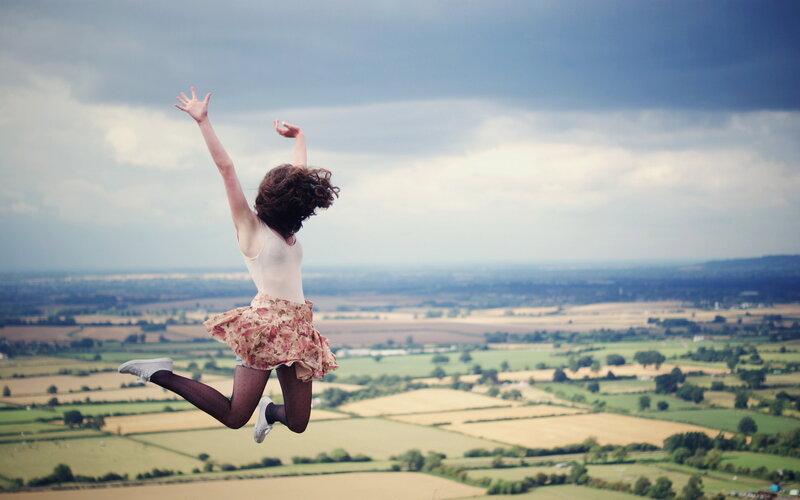 Woman Jumping Outdoors — Blue