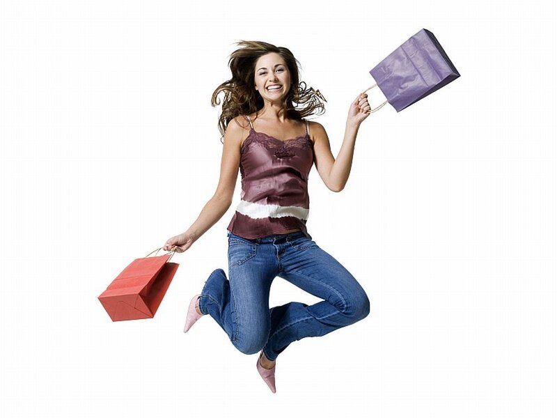 Woman Jumping with Bags