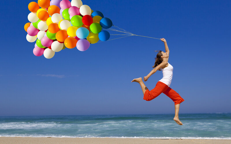 Woman Jumping with Balloons — Blue
