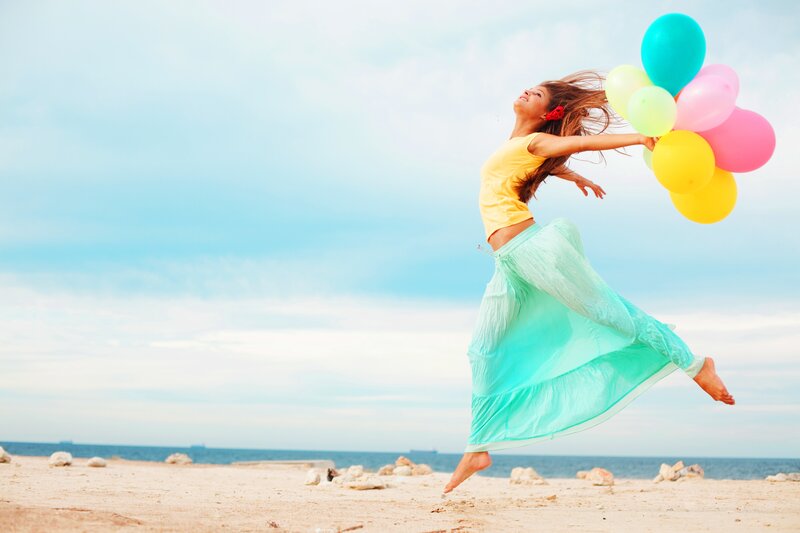 Woman Jumping with Balloons — Yellow