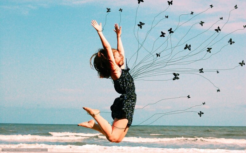 woman jumping with butterflies