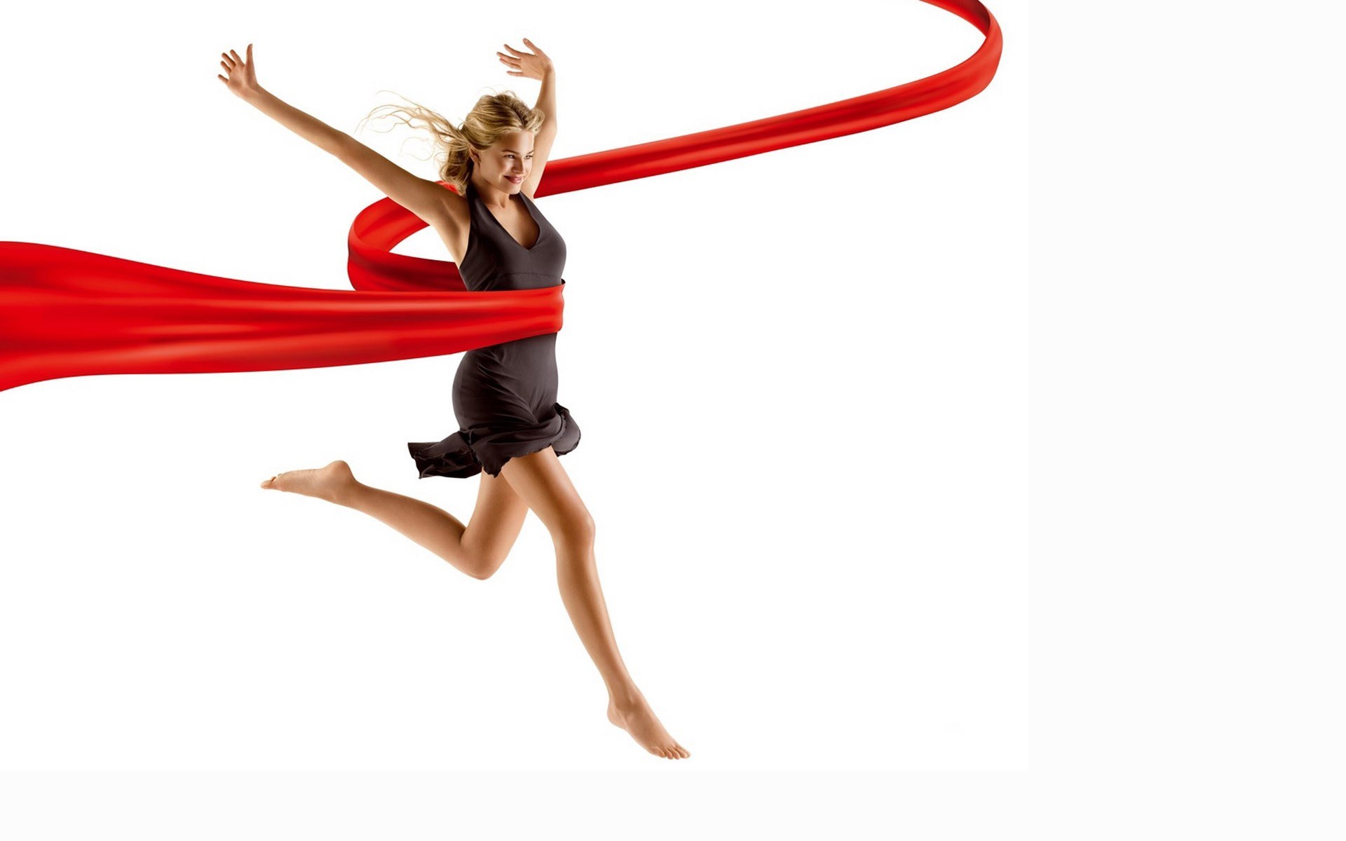 woman jumping with red ribbon