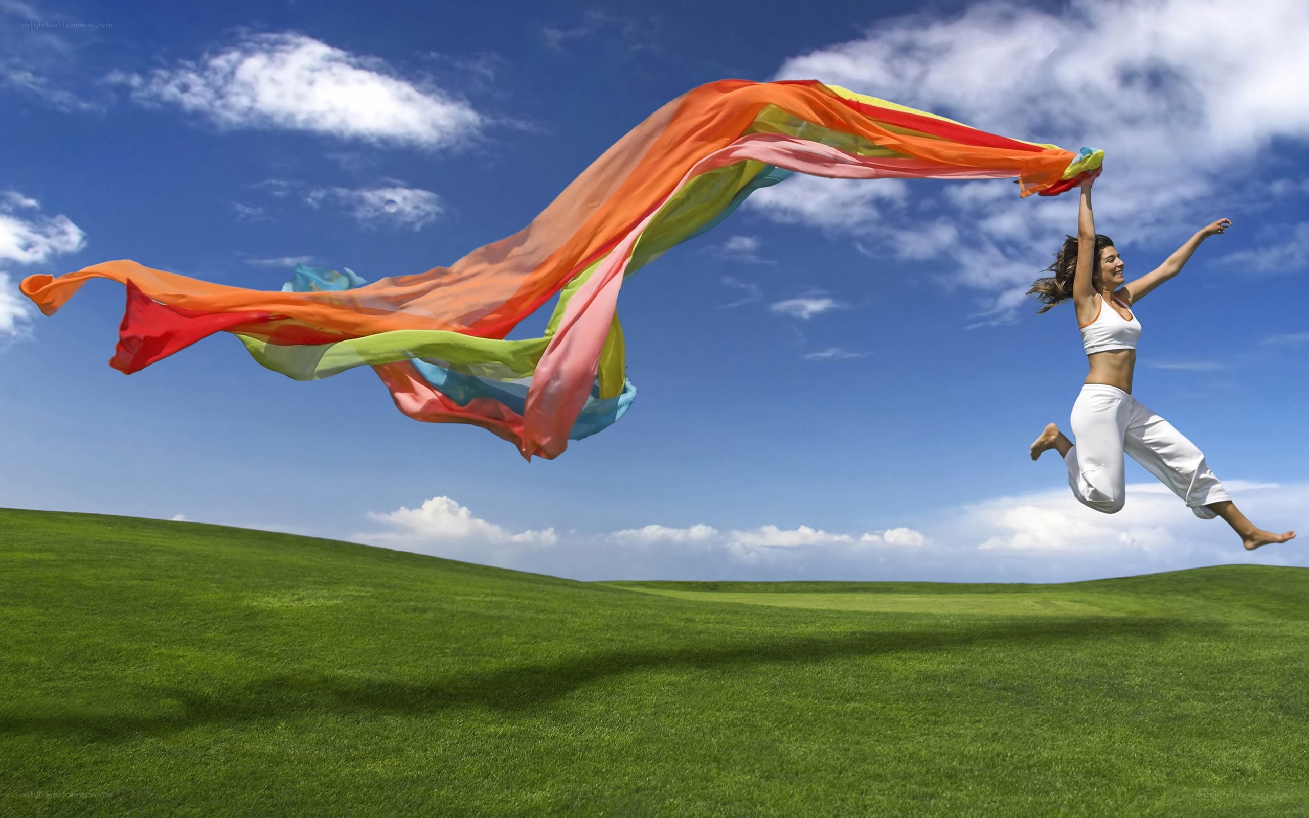 Woman jumping with scarf