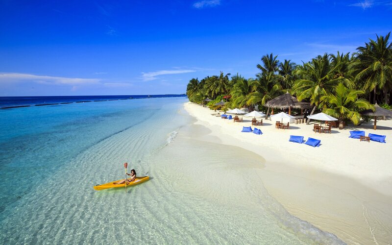 Woman Kayaking in Ocean