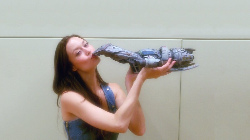 woman kissing a spaceship model