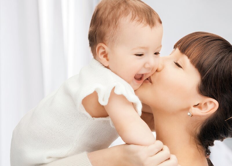 Woman Kissing Baby — White, Affectionate, Photograph