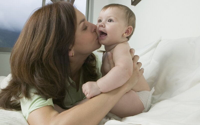Woman Kissing Baby — White, Affectionate