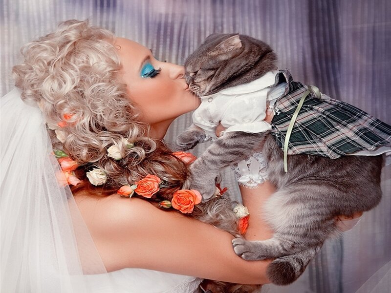 Woman Kissing Cat