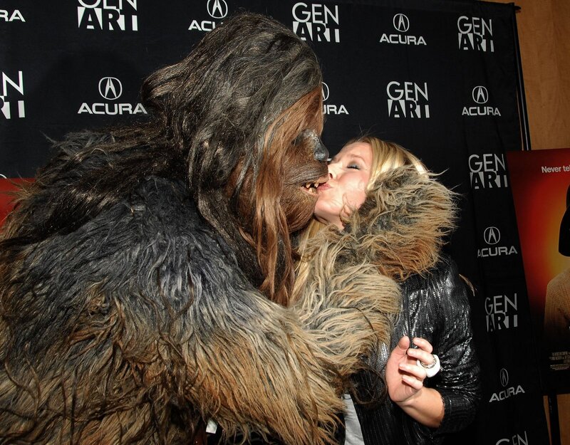woman kissing chewbacca