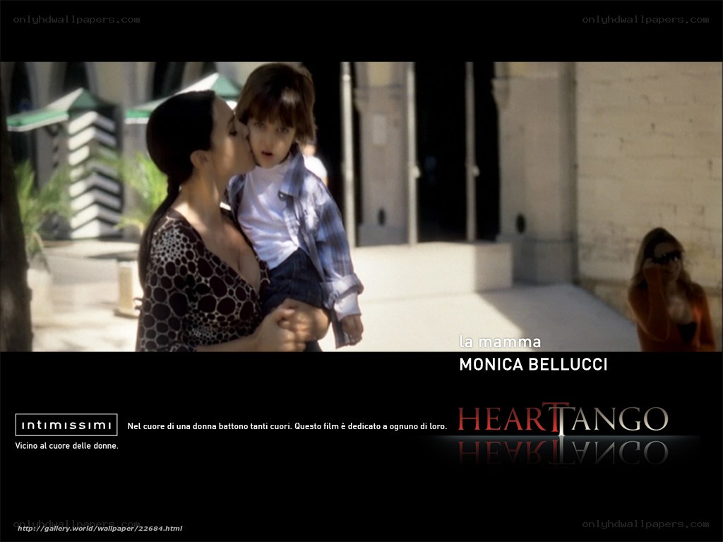 woman kissing child on cheek