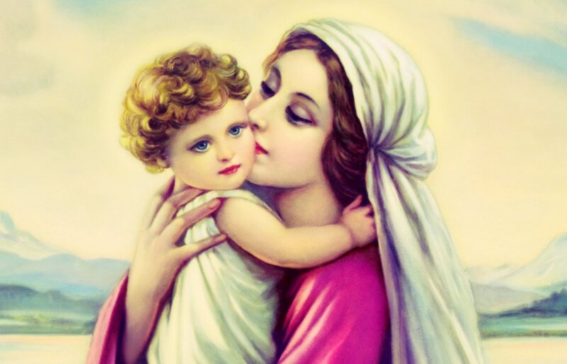 Woman Kissing Child