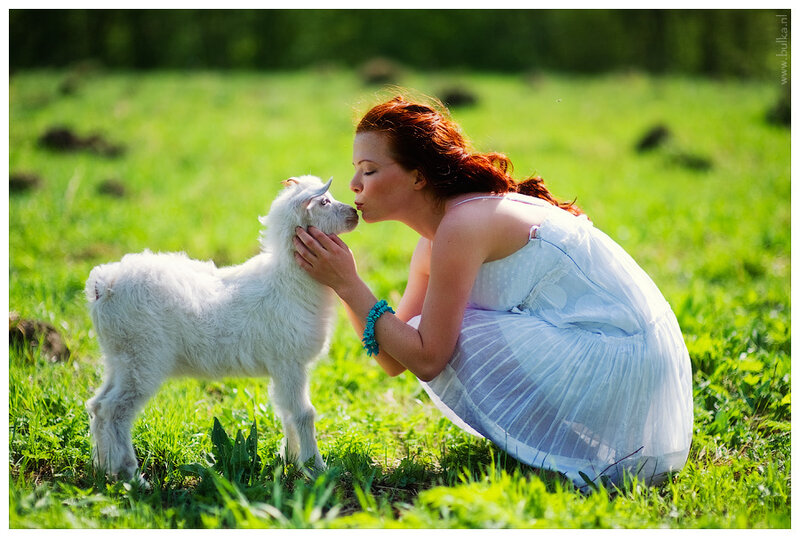 Woman Kissing Goat