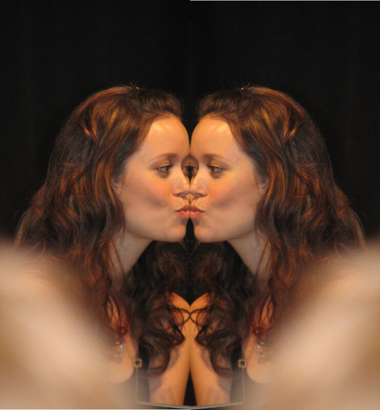 woman kissing her reflection