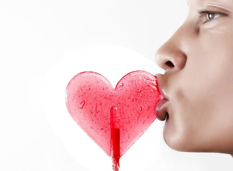 Woman Kissing Lollipop