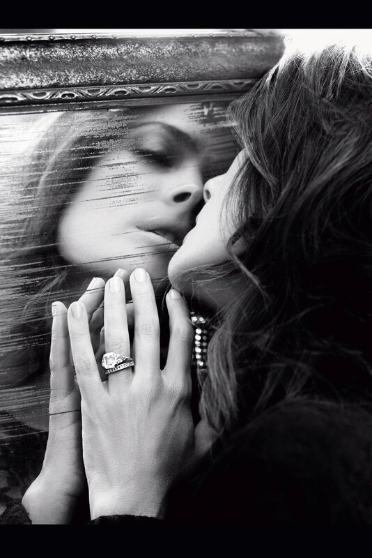 woman kissing mirror reflection