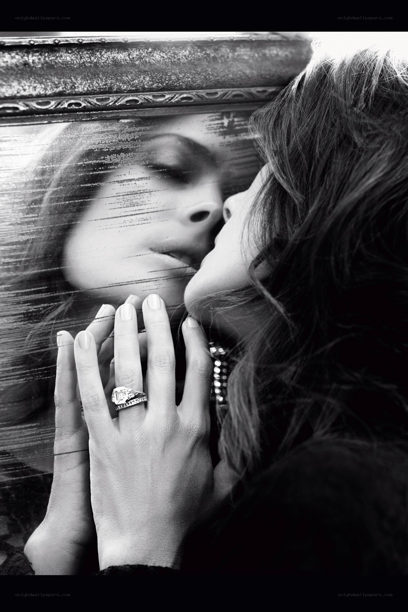 woman kissing mirror reflection