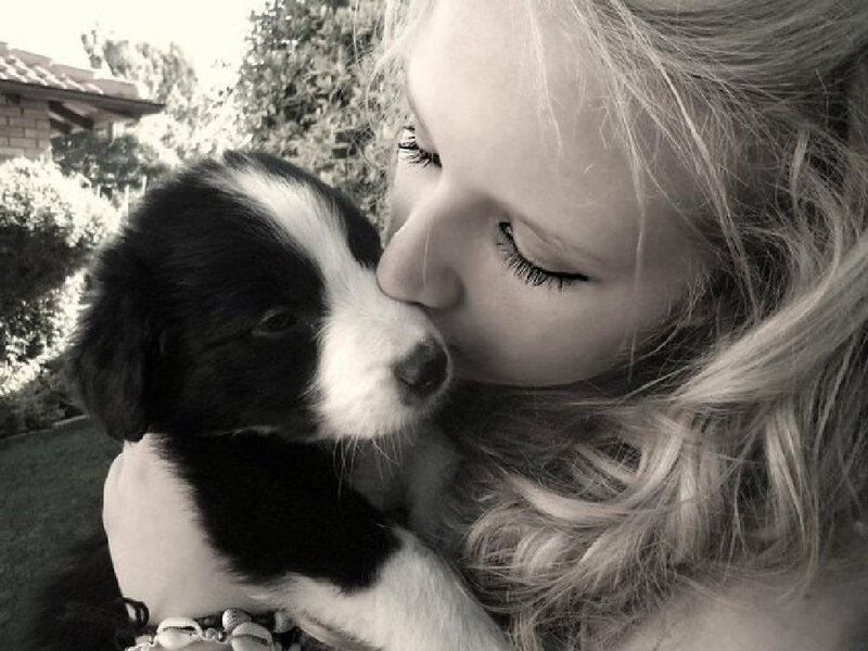 Woman Kissing Puppy