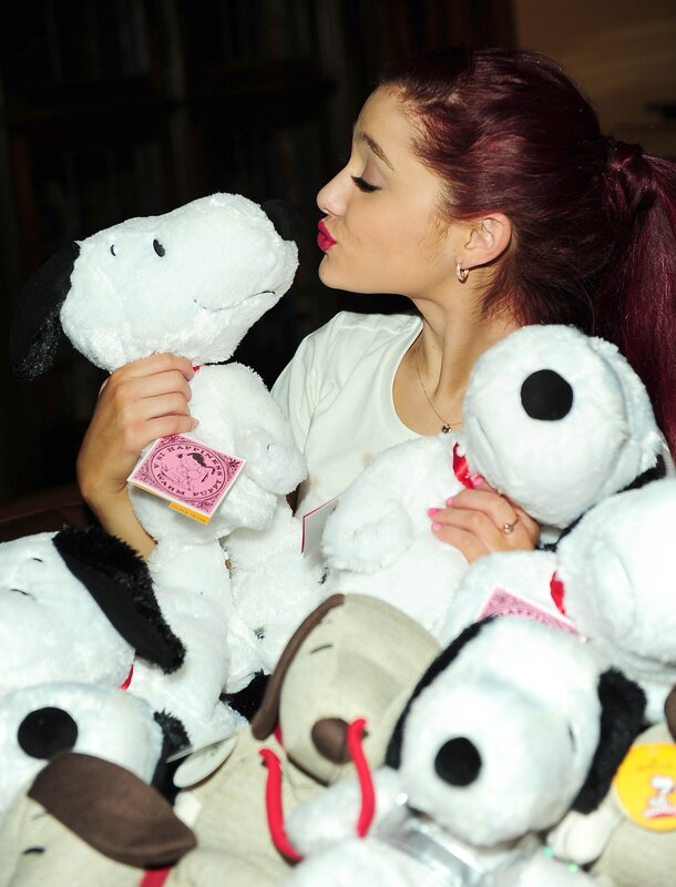 Woman kissing snoopy plush