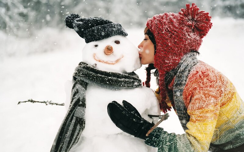 woman kissing snowman