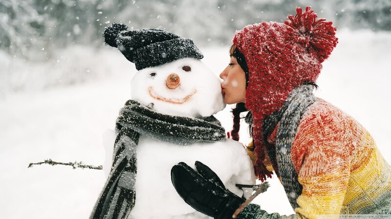 woman kissing snowman