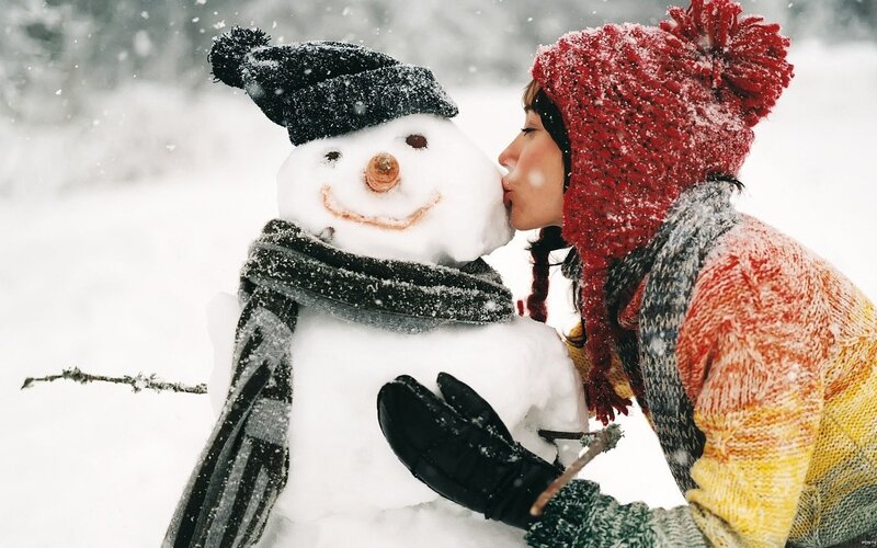 woman kissing snowman