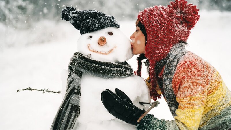 woman kissing snowman