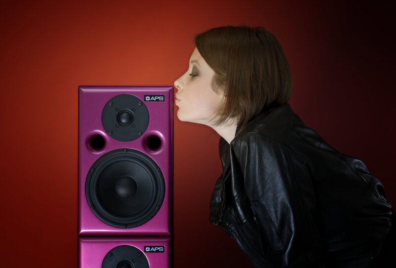 woman kissing speaker