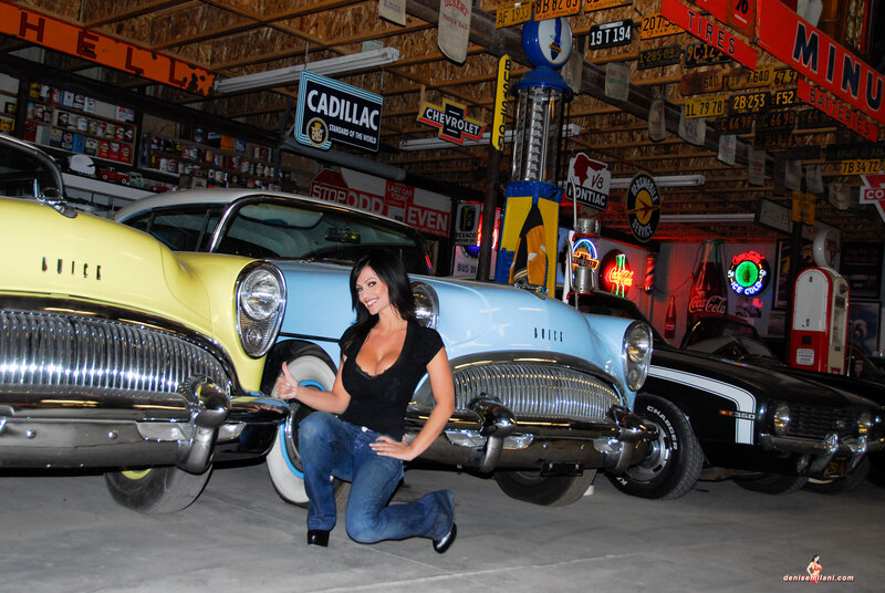 Woman Kneeling by Cars