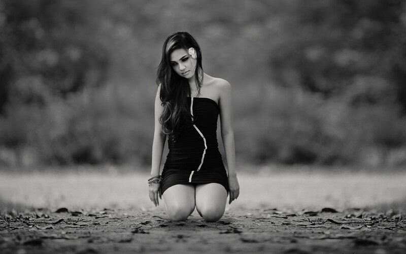 woman kneeling in black and white