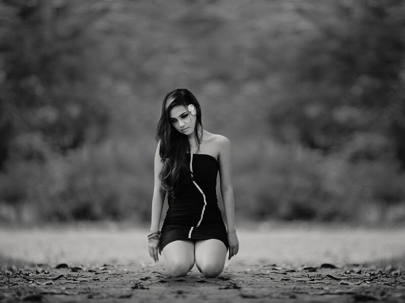 woman kneeling in black and white