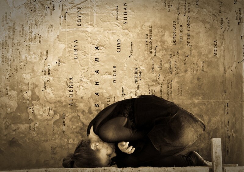 Woman Kneeling on Map