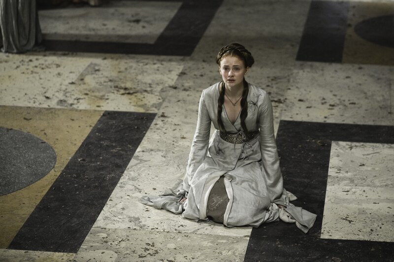 Woman kneeling on stone floor