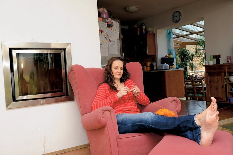 Woman Knitting in Armchair