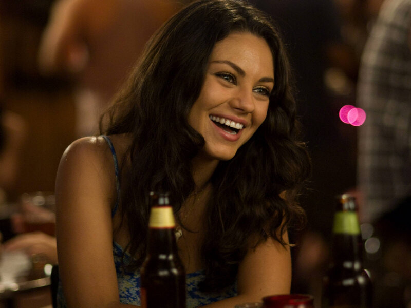 woman laughing at bar