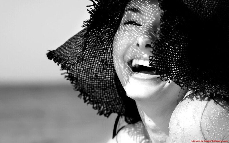woman laughing at beach