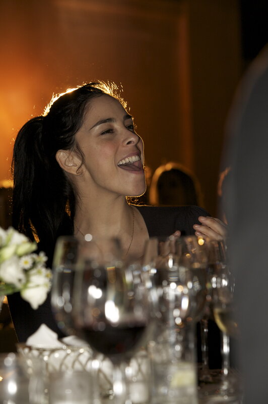 woman laughing at dinner