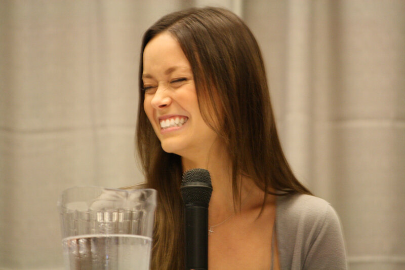 woman laughing at microphone