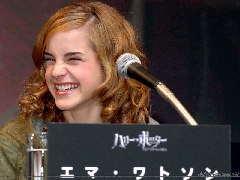 Woman Laughing at Podium