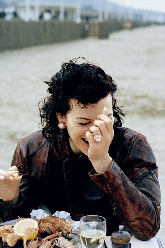 Woman laughing at seafood meal