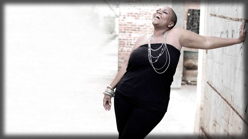 woman laughing in alley