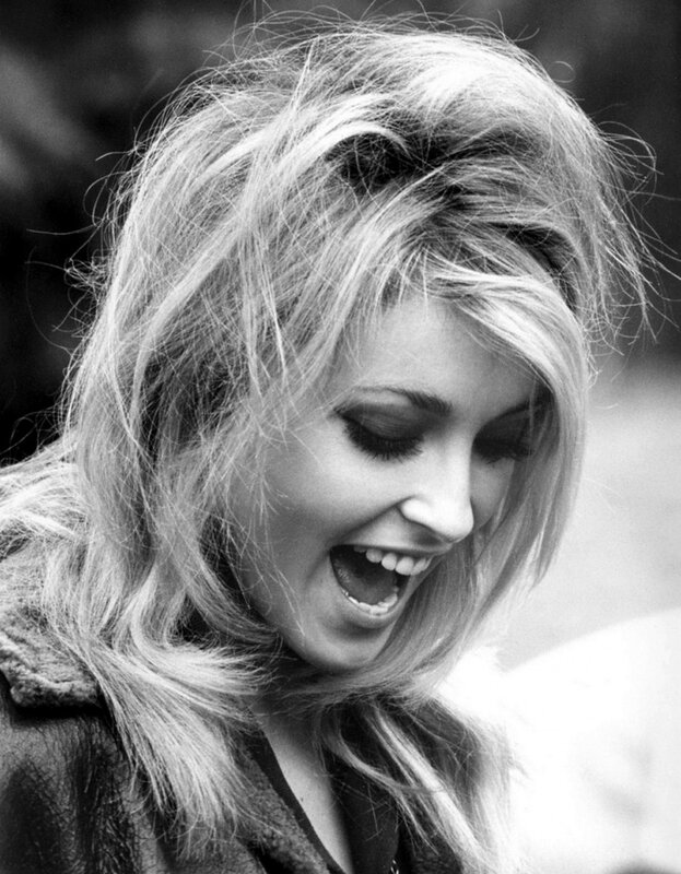woman laughing in black and white